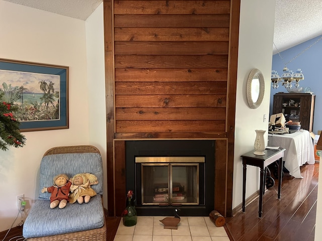 details with wood-type flooring and a textured ceiling