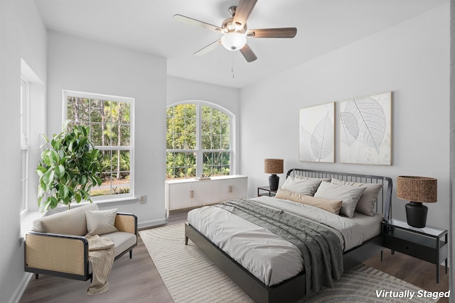 bedroom with hardwood / wood-style flooring and ceiling fan