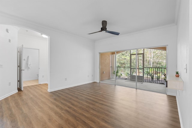 unfurnished room with ceiling fan, wood-type flooring, and ornamental molding