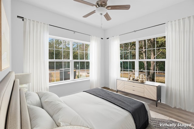 bedroom featuring ceiling fan and hardwood / wood-style floors