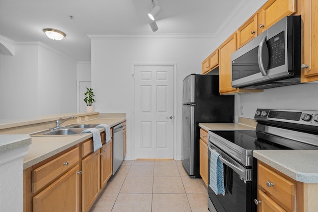 kitchen with appliances with stainless steel finishes, light tile patterned flooring, crown molding, sink, and kitchen peninsula