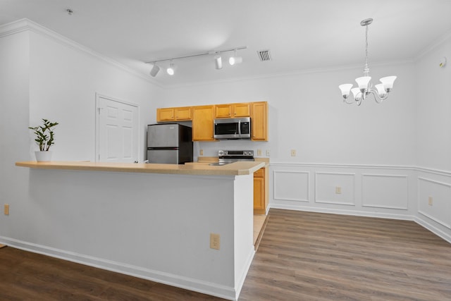 kitchen with kitchen peninsula, stainless steel appliances, dark wood-type flooring, light brown cabinets, and pendant lighting