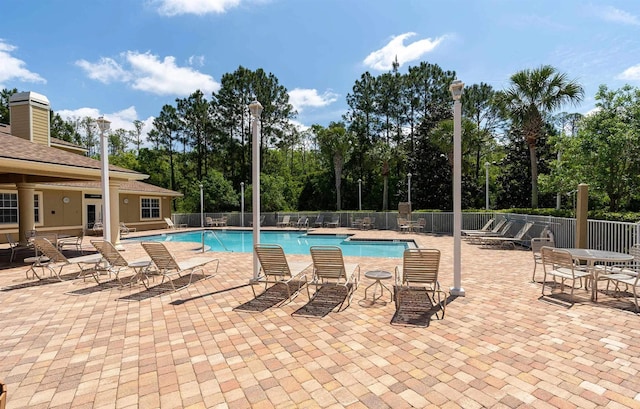 view of swimming pool featuring a patio area