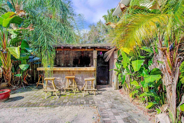 543 Ray Edwards Rd, Saint Augustine, FL 32086 - back of house with a patio area, a chimney, and outdoor dry bar