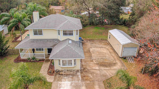 543 Ray Edwards Rd, Saint Augustine, FL 32086 - traditional home with fence, a chimney, covered porch, and a front yard