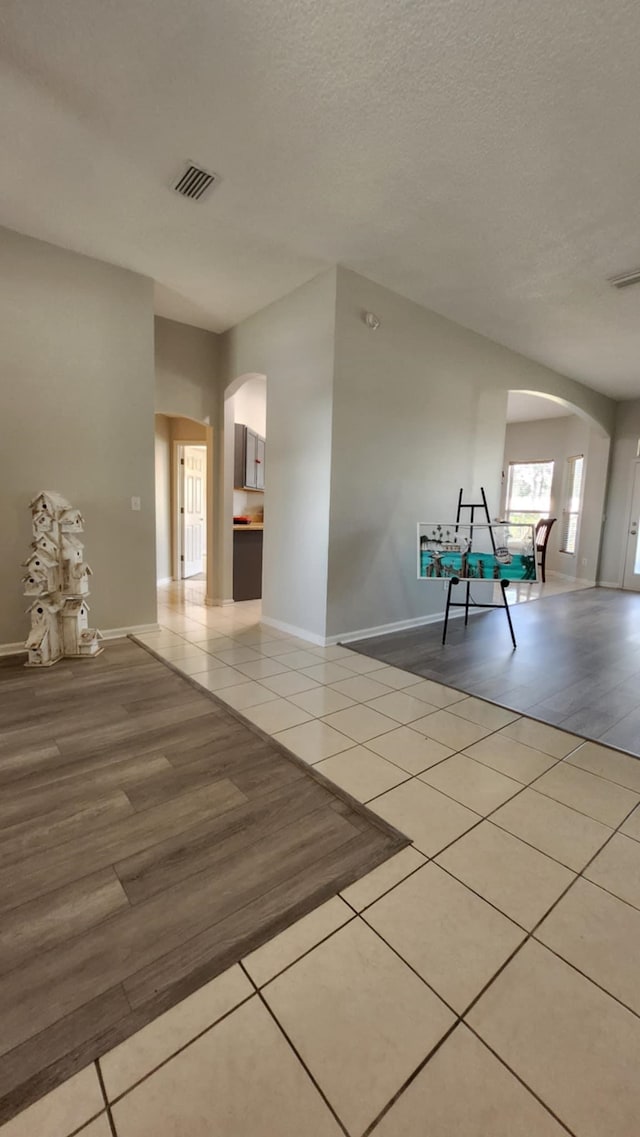 708 Blackmoor Gate Ln, Saint Augustine, FL 32084 - tiled spare room with arched walkways and baseboards