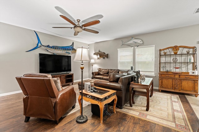 living room with hardwood / wood-style flooring and ceiling fan