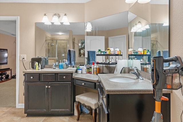 bathroom with vanity and a shower with door