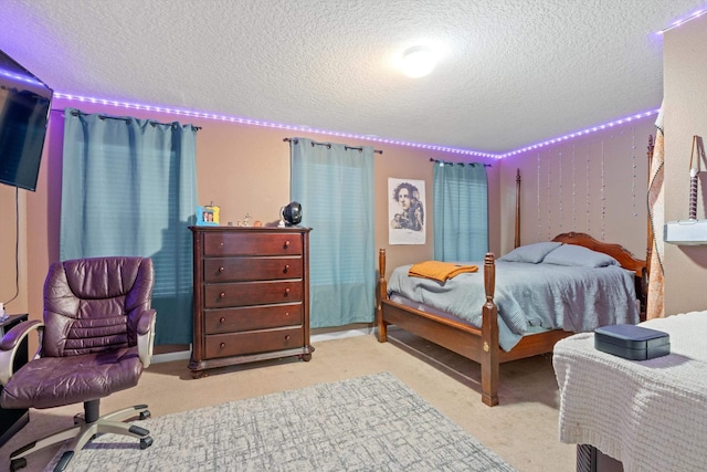 carpeted bedroom featuring a textured ceiling