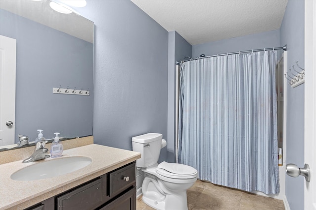 bathroom featuring walk in shower, tile patterned floors, a textured ceiling, toilet, and vanity