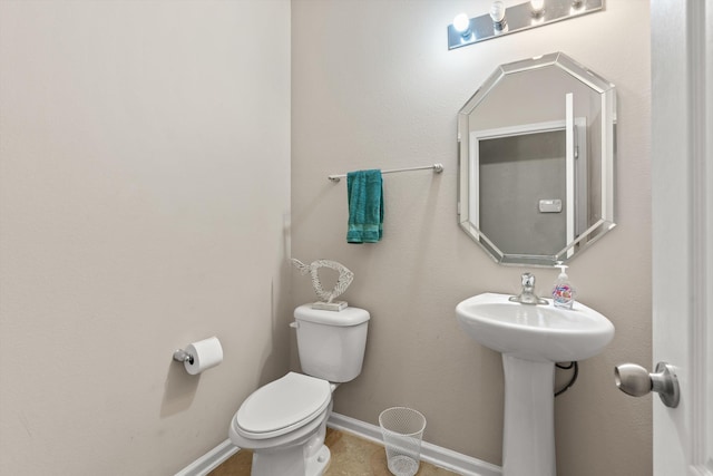 bathroom featuring sink and toilet