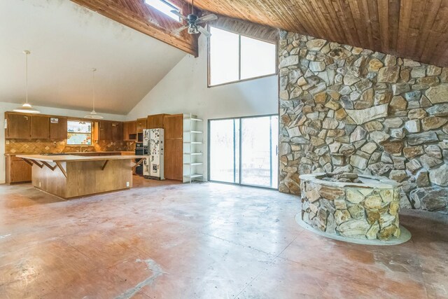 19 Casanova Rd, Saint Augustine, FL 32080 - unfurnished living room with high vaulted ceiling, unfinished concrete flooring, plenty of natural light, wooden ceiling, and beamed ceiling