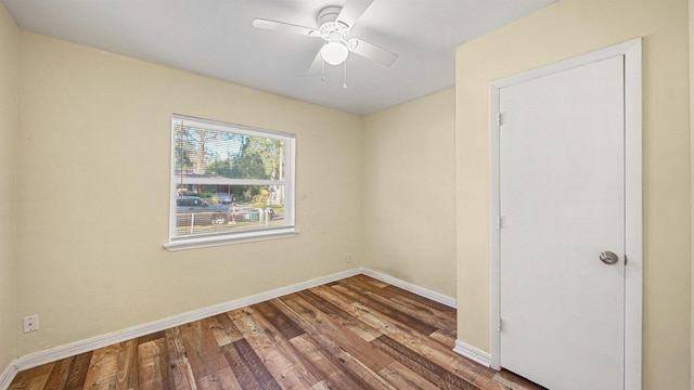 spare room featuring ceiling fan and wood-type flooring