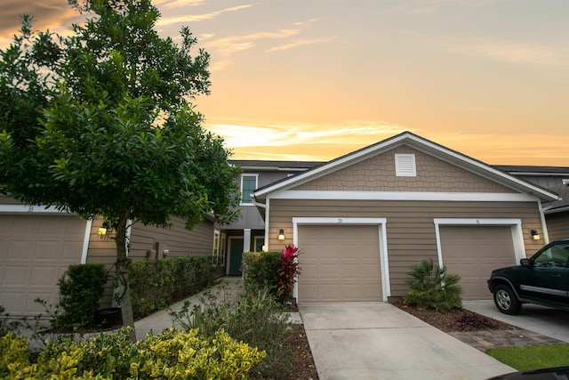 view of front of property with driveway and a garage