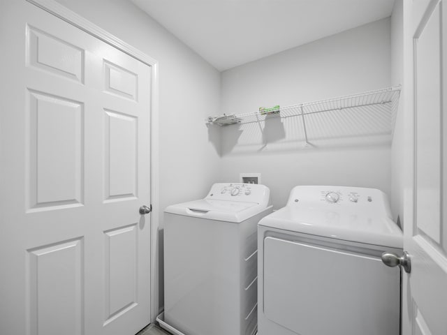 laundry room with independent washer and dryer