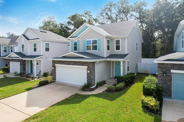 view of front of house with a garage and a front lawn