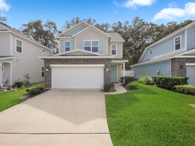 view of front of house featuring a front yard and a garage