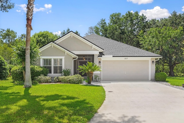 ranch-style home with a garage, driveway, a front yard, and stucco siding