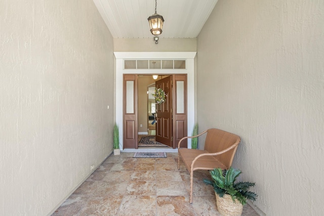 view of exterior entry featuring stucco siding