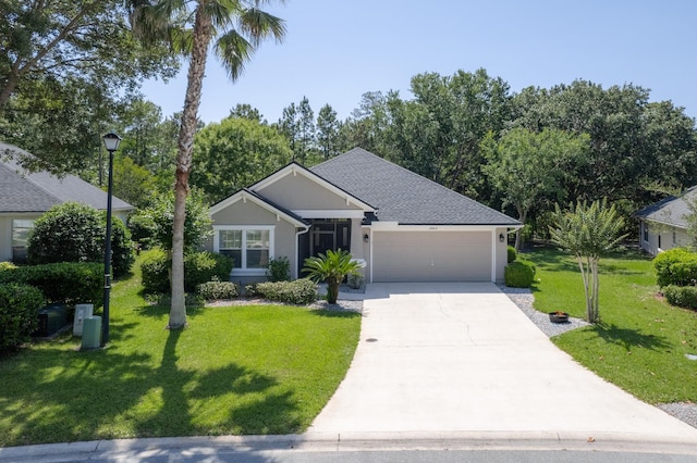 single story home featuring an attached garage, driveway, a front yard, and stucco siding