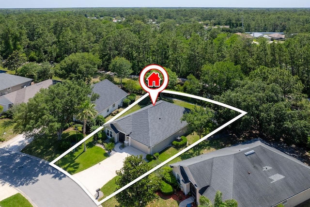 view of property location featuring a heavily wooded area and property boundaries highlighted