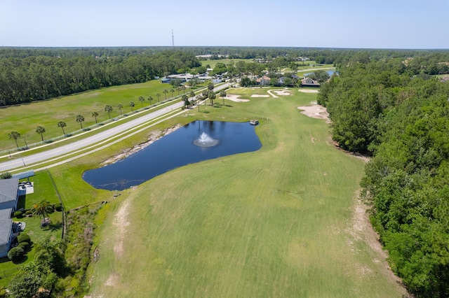 drone / aerial view of a nearby body of water and a golf club