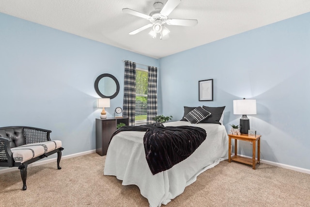 bedroom with carpet flooring, baseboards, and a ceiling fan