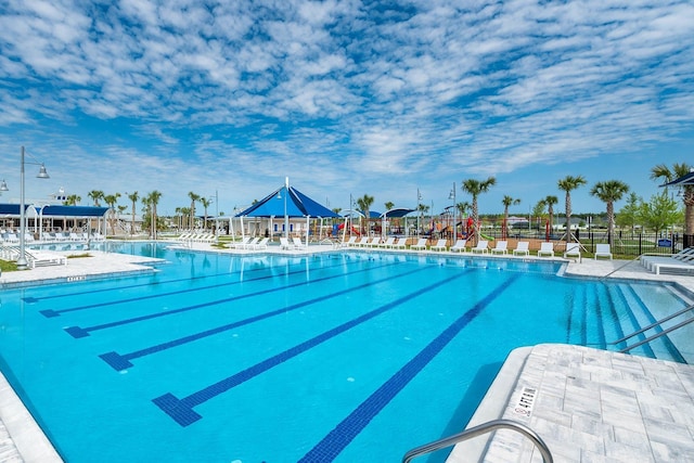 community pool featuring fence