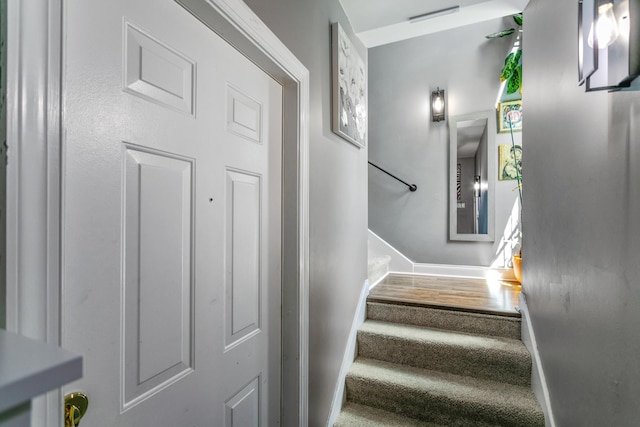 stairs with hardwood / wood-style floors