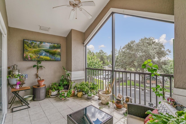 sunroom / solarium with ceiling fan