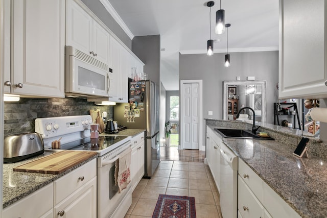 kitchen with white cabinetry, sink, white appliances, and ornamental molding