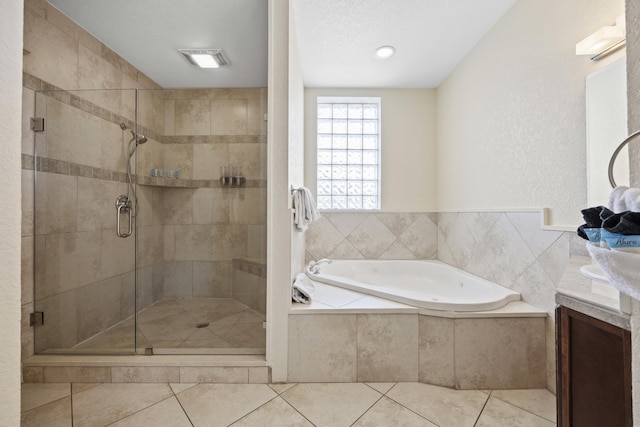 bathroom with tile patterned flooring, vanity, and independent shower and bath