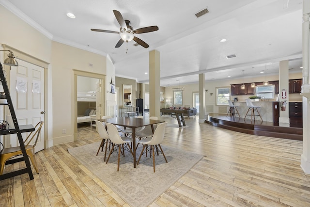 dining area featuring light hardwood / wood-style floors, ceiling fan, crown molding, and billiards