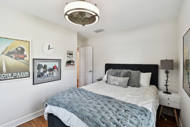 bedroom with hardwood / wood-style floors