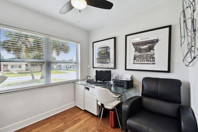 office with hardwood / wood-style flooring and ceiling fan