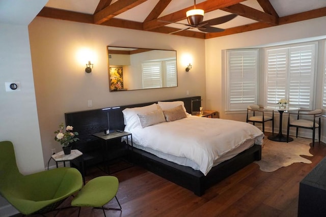 bedroom with ceiling fan, lofted ceiling with beams, and wood finished floors