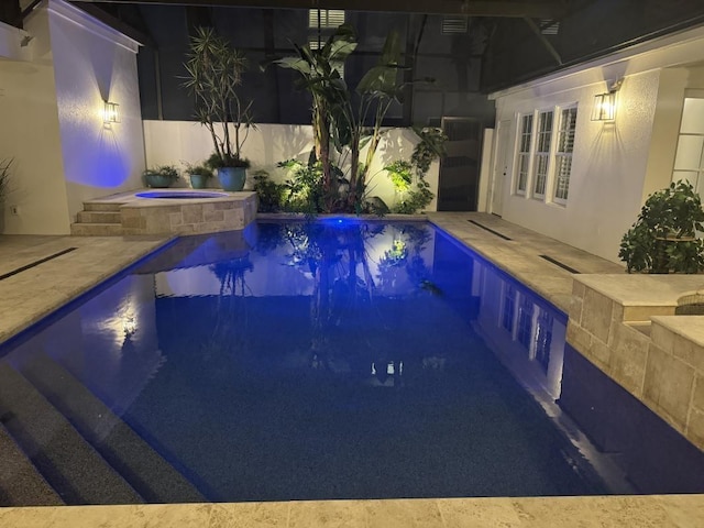 view of pool with a fenced in pool, an in ground hot tub, and a patio area