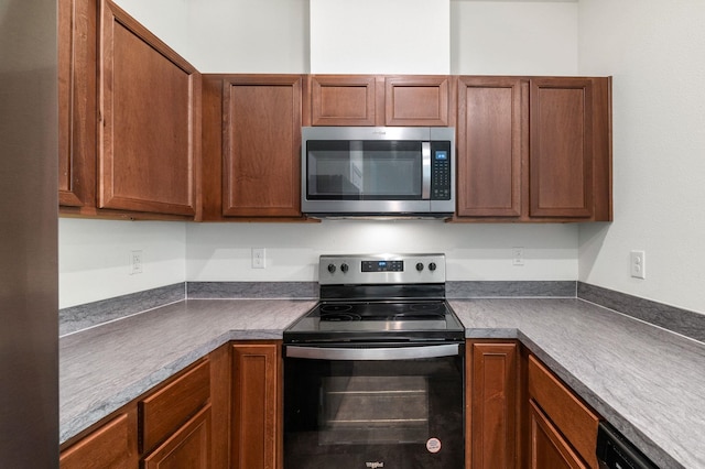 69 Mustard Hill Ct, Saint Augustine, FL 32086 - kitchen with stainless steel appliances and dark countertops