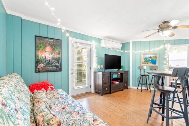 1440 Corunna St, Saint Augustine, FL 32080 - living room featuring ceiling fan, wood finished floors, and a wall unit AC