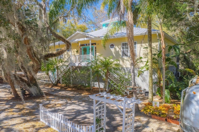 1440 Corunna St, Saint Augustine, FL 32080 - beach home with stairway, fence, a pergola, covered porch, and metal roof