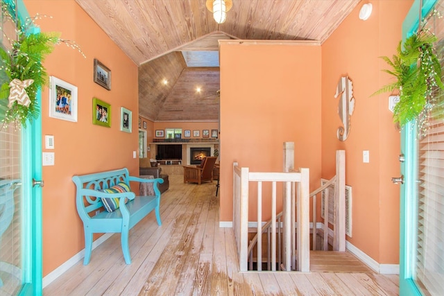 1440 Corunna St, Saint Augustine, FL 32080 - hallway with hardwood / wood-style flooring, an upstairs landing, wood ceiling, and baseboards