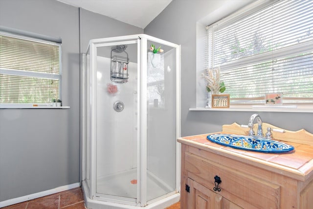 1440 Corunna St, Saint Augustine, FL 32080 - bathroom with tile patterned flooring, a shower stall, baseboards, and a sink