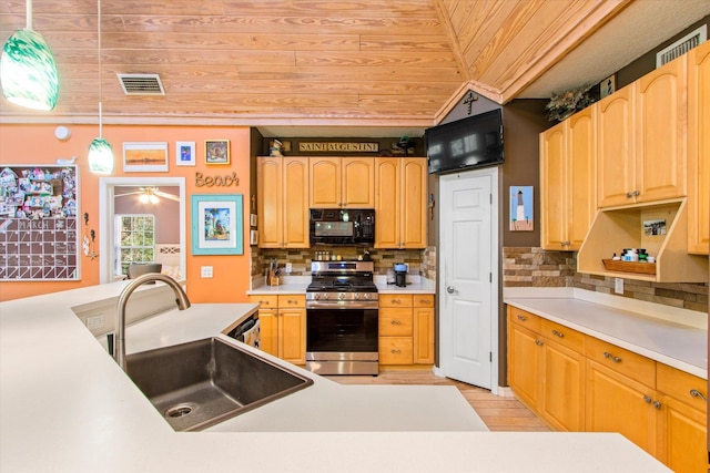 1440 Corunna St, Saint Augustine, FL 32080 - kitchen with visible vents, a sink, gas stove, wooden ceiling, and black microwave