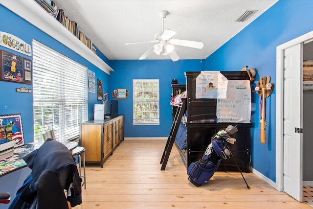 1440 Corunna St, Saint Augustine, FL 32080 - bedroom with a ceiling fan, baseboards, visible vents, hardwood / wood-style flooring, and a textured ceiling