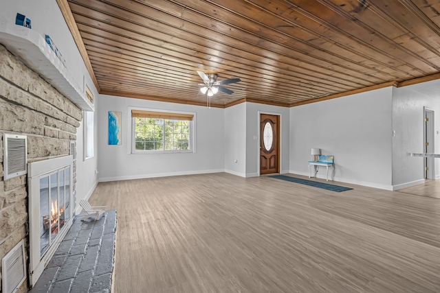 unfurnished living room with a fireplace, wooden ceiling, hardwood / wood-style floors, and ceiling fan