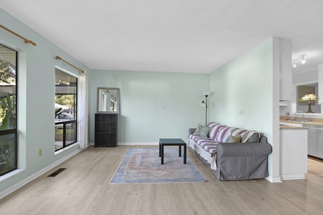 living room with light wood-style floors and baseboards