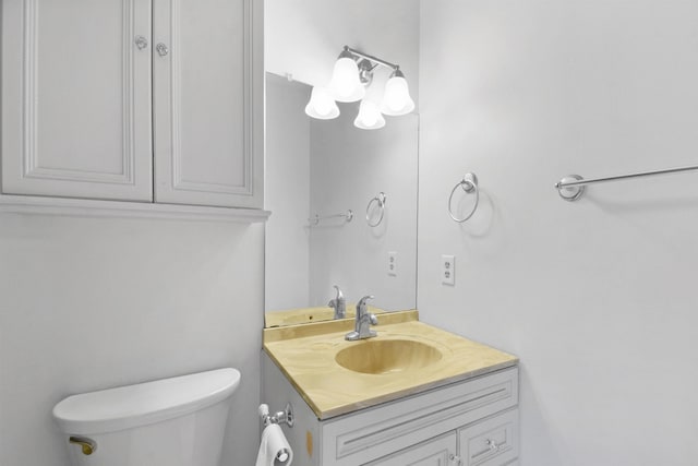 bathroom with toilet and vanity