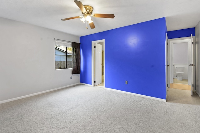 unfurnished bedroom with carpet, baseboards, and a ceiling fan