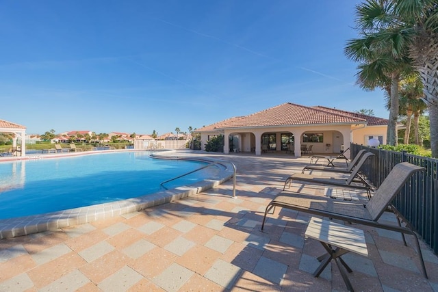 view of swimming pool with a patio area