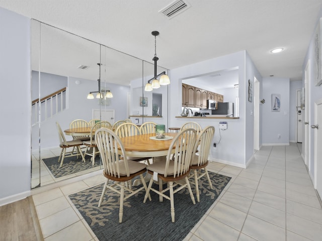 dining room featuring light tile patterned floors